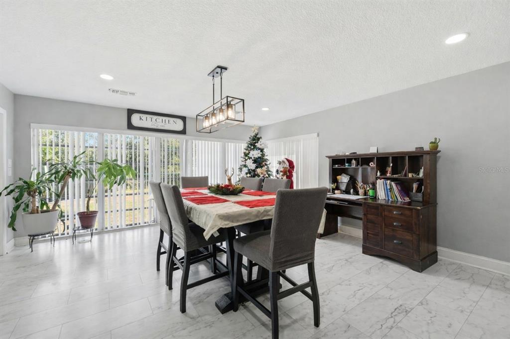 518 West Lake Wales Road North Lake Wales, FL 33859 - Photo 8 of 28 a view of a dining room with furniture window and outside view