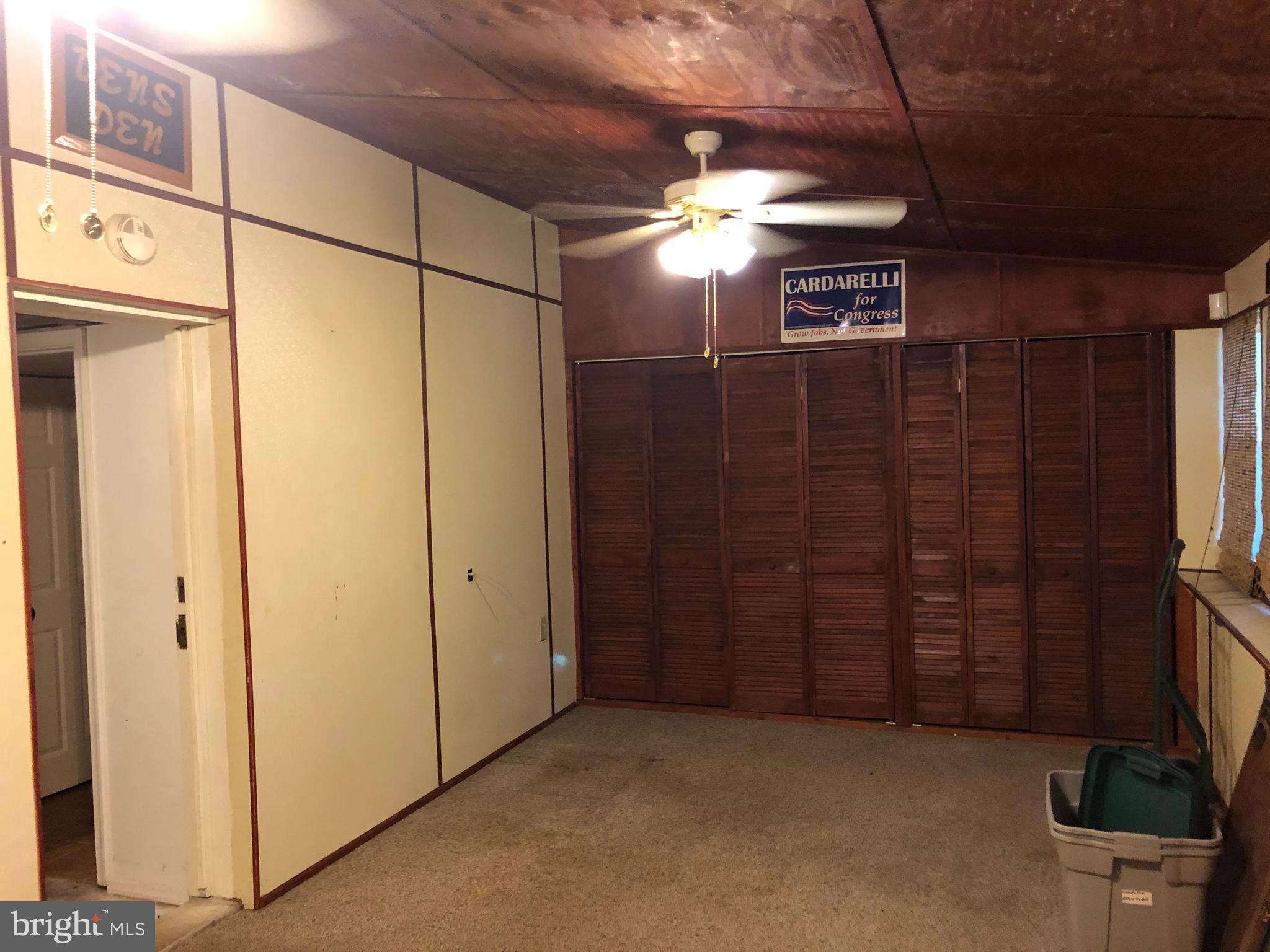 1628 Colony Road Pasadena, MD 21122 - Photo 17 of 29 Porch opposite view with storage closets.