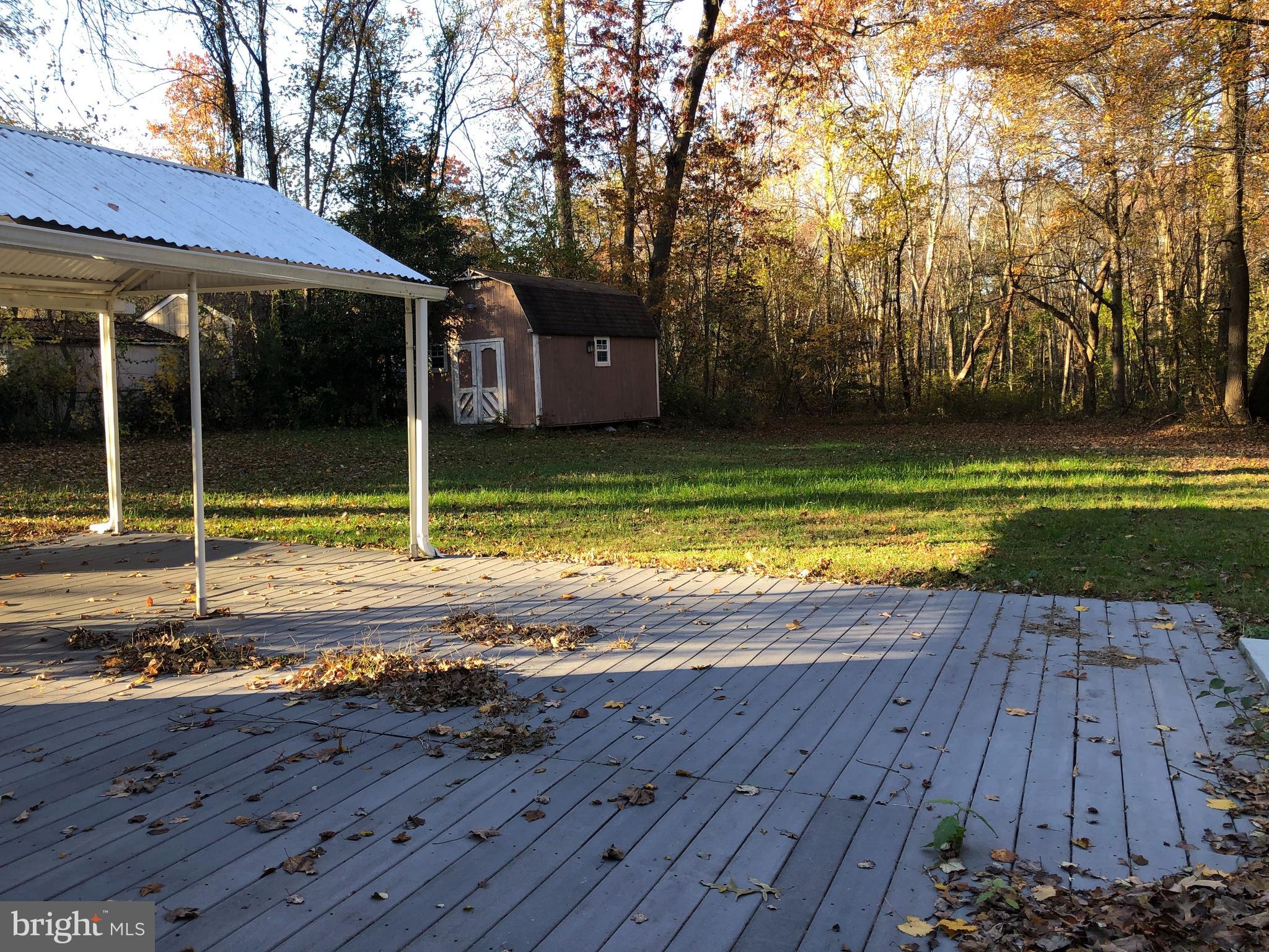 1628 Colony Road Pasadena, MD 21122 - Photo 21 of 29 Rear ground-level deck.