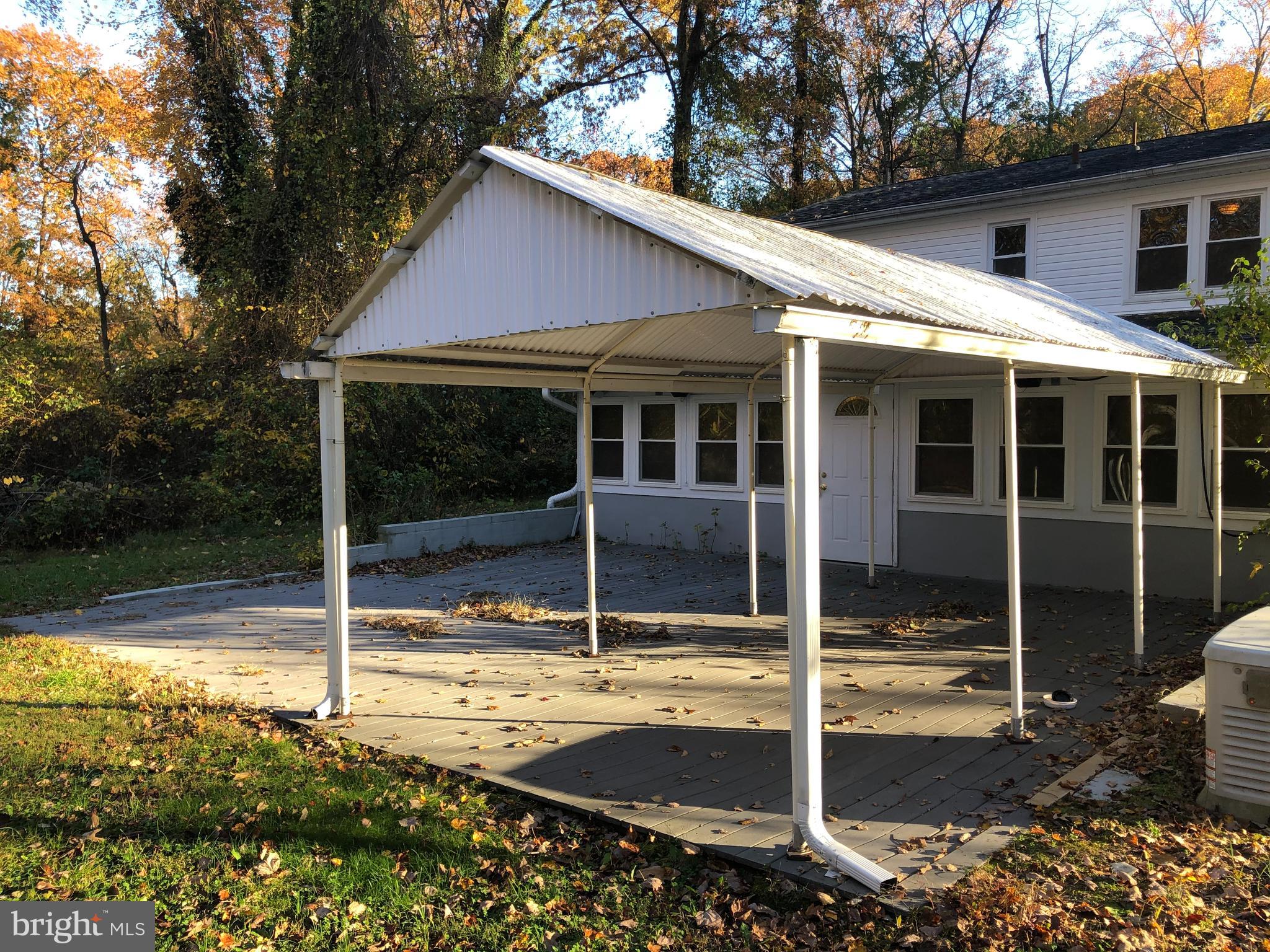 1628 Colony Road Pasadena, MD 21122 - Photo 22 of 29 Rear deck w/covered pavilion.