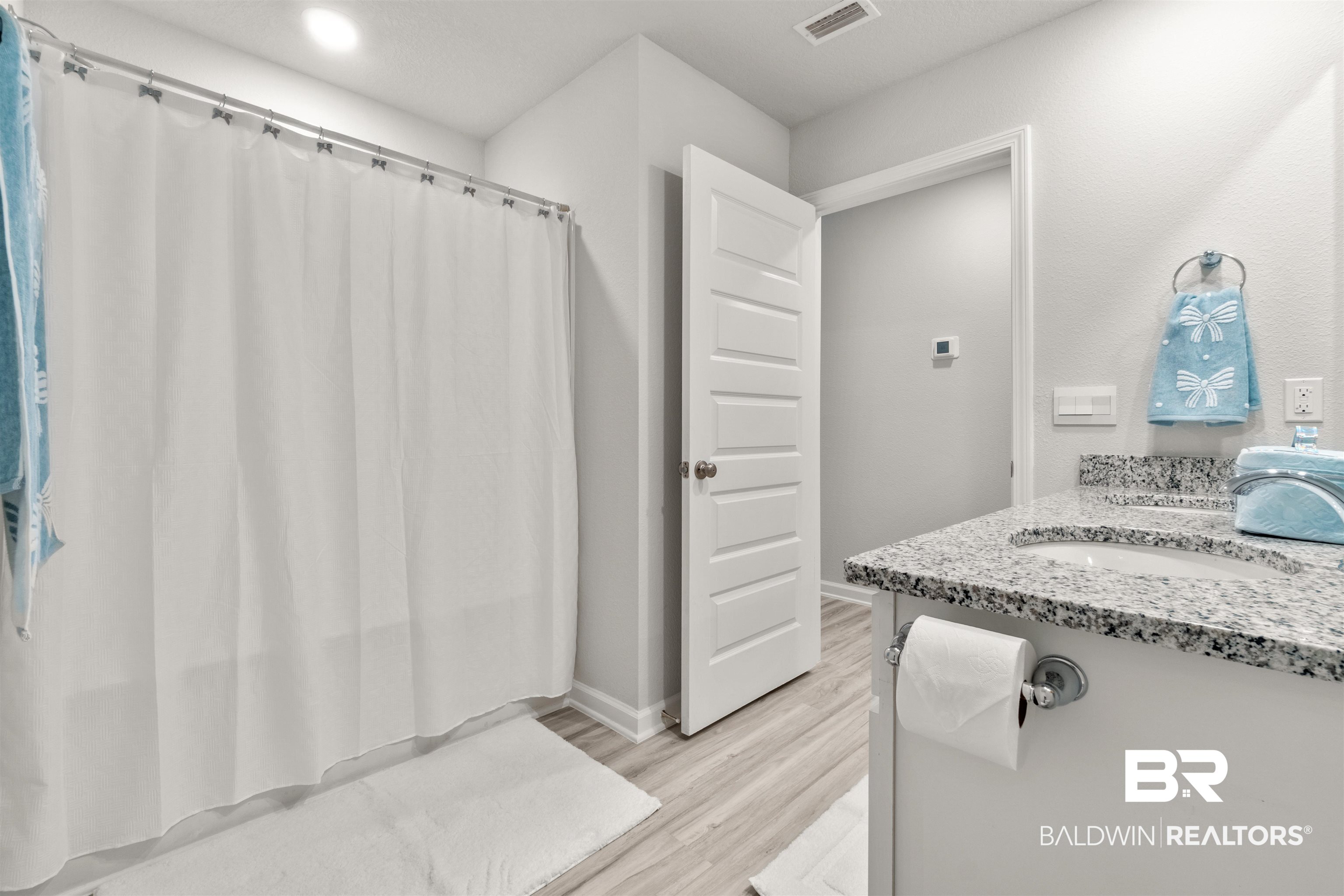24472 Ringneck Loop Elberta, AL 36530 - Photo 30 of 46 Bathroom featuring vanity and wood-type flooring