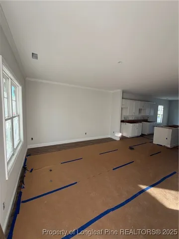 a kitchen with a cabinets and wooden floor