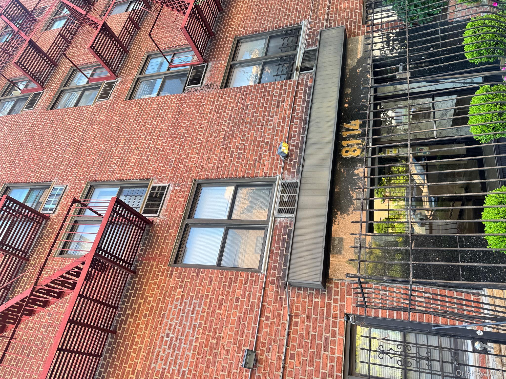 a view of a brick building from a balcony