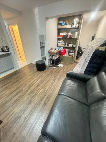 a bedroom with furniture and a flat screen tv