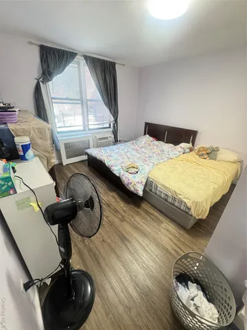 a bedroom with bed and balcony