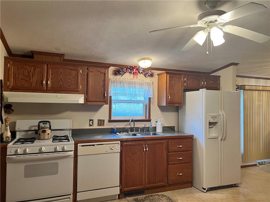 945 Old Princeton Road New Castle, PA 16101 - Photo 3 of 12 a kitchen with refrigerator cabinets and window