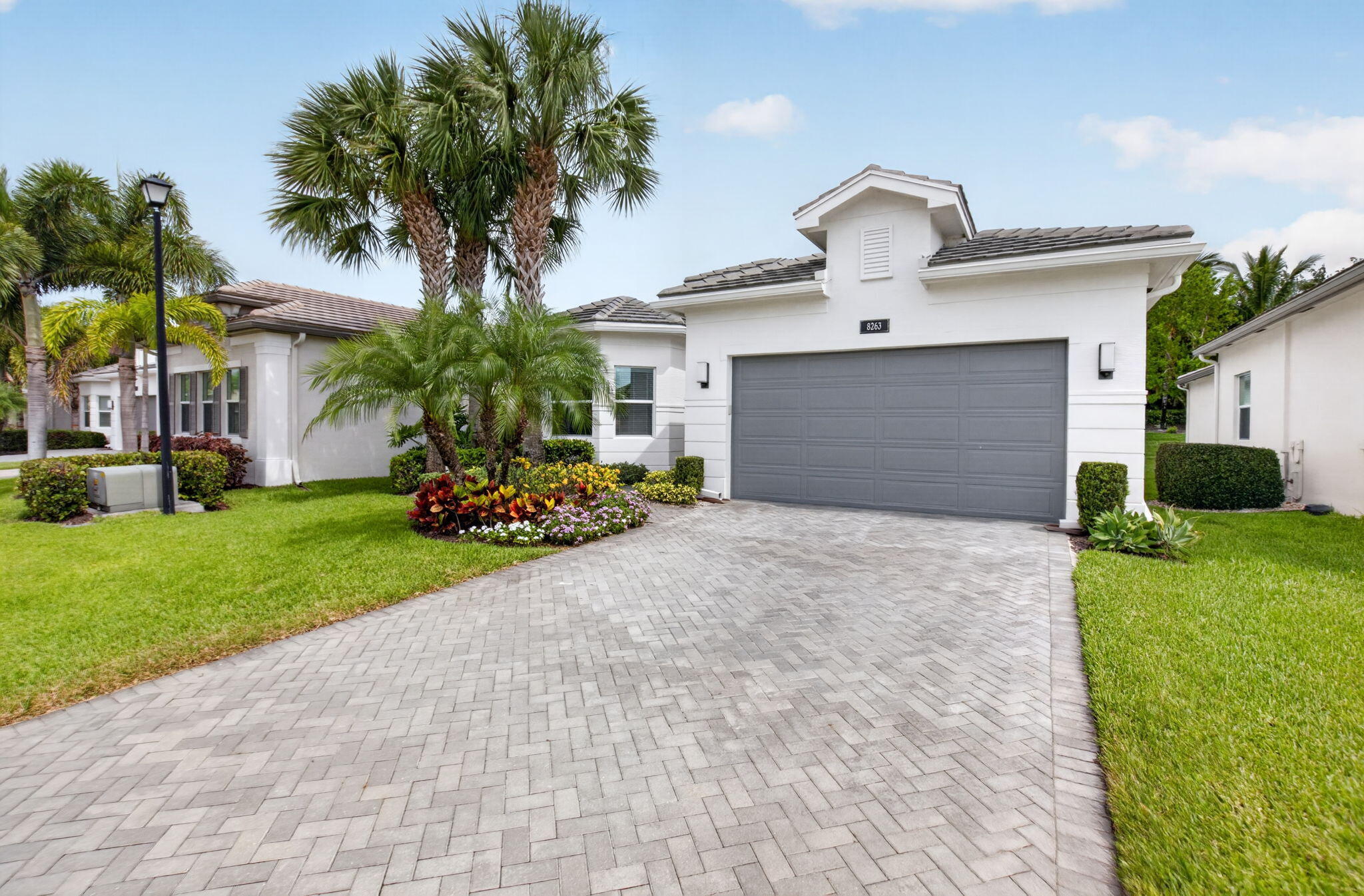 8263 Arabian Range Road Boynton Beach, FL 33473 - Photo 3 of 52 a front view of house with yard and green space