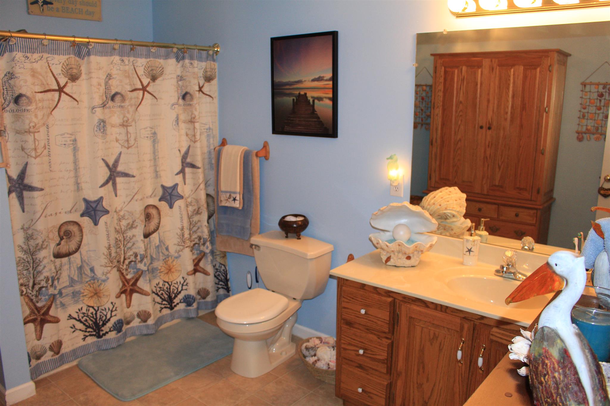 536 Strawberry Ridge Manchester, TN 37355 - Photo 19 of 30 a bathroom with a toilet sink and mirror