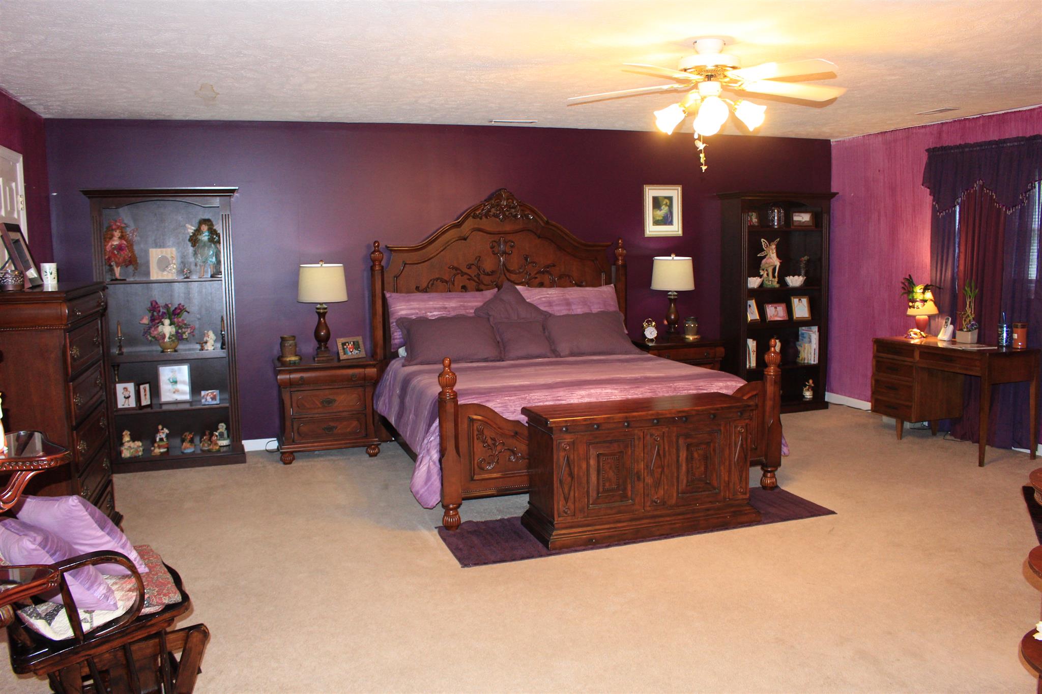 536 Strawberry Ridge Manchester, TN 37355 - Photo 20 of 30 a bedroom with a bed and a chandelier