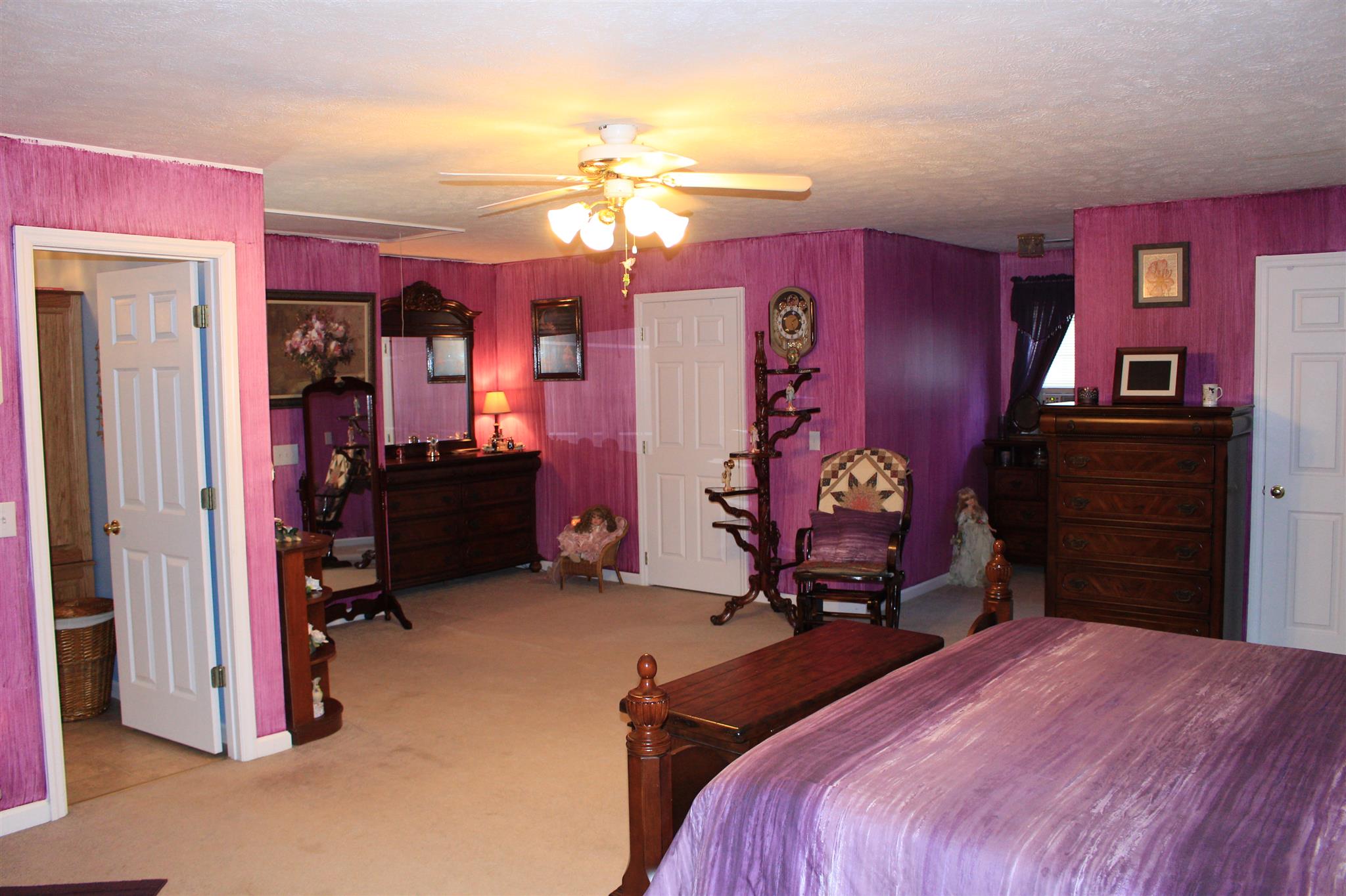 536 Strawberry Ridge Manchester, TN 37355 - Photo 21 of 30 a bedroom with a bed and a chandelier