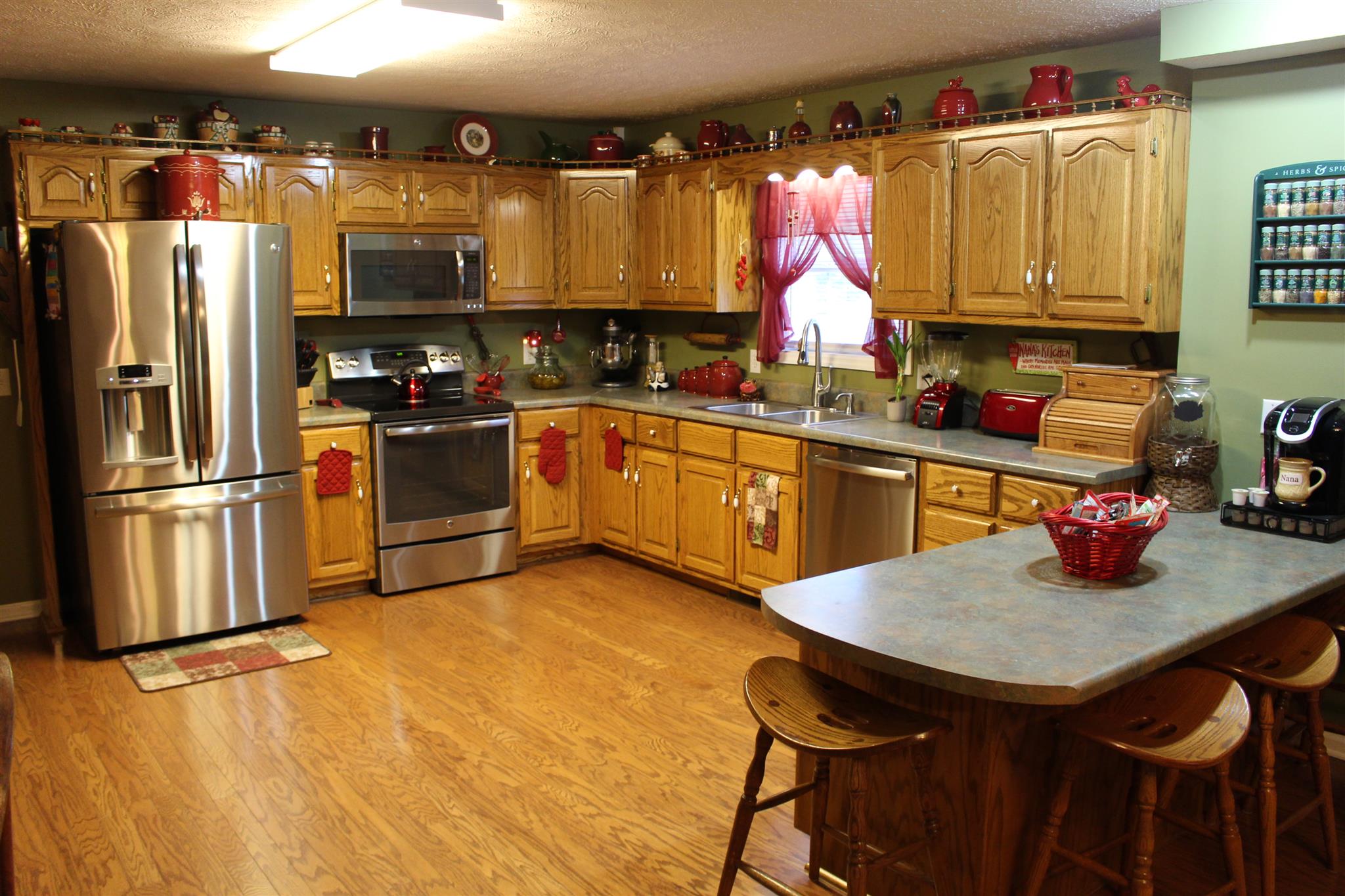 536 Strawberry Ridge Manchester, TN 37355 - Photo 8 of 30 a kitchen with stainless steel appliances granite countertop a kitchen island a stove a sink cabinets and a dining table