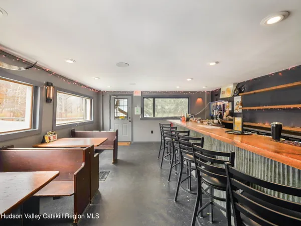 a kitchen with stainless steel appliances a sink and a large window
