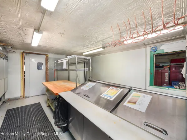 a kitchen with a sink appliances and cabinets