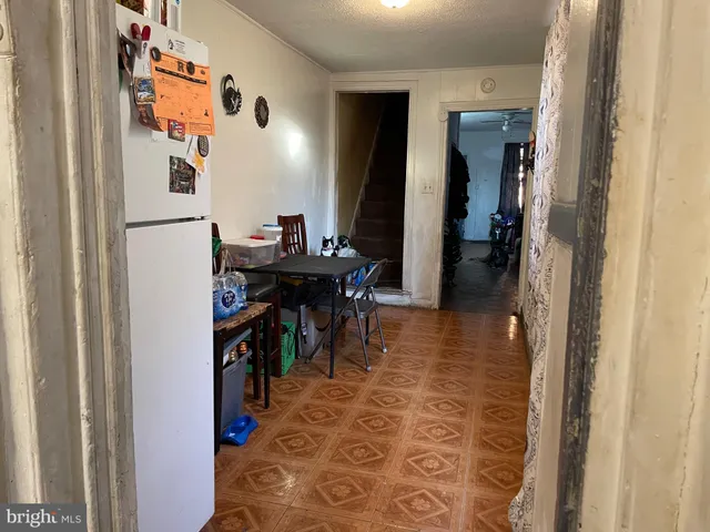a view of a hallway with dining area