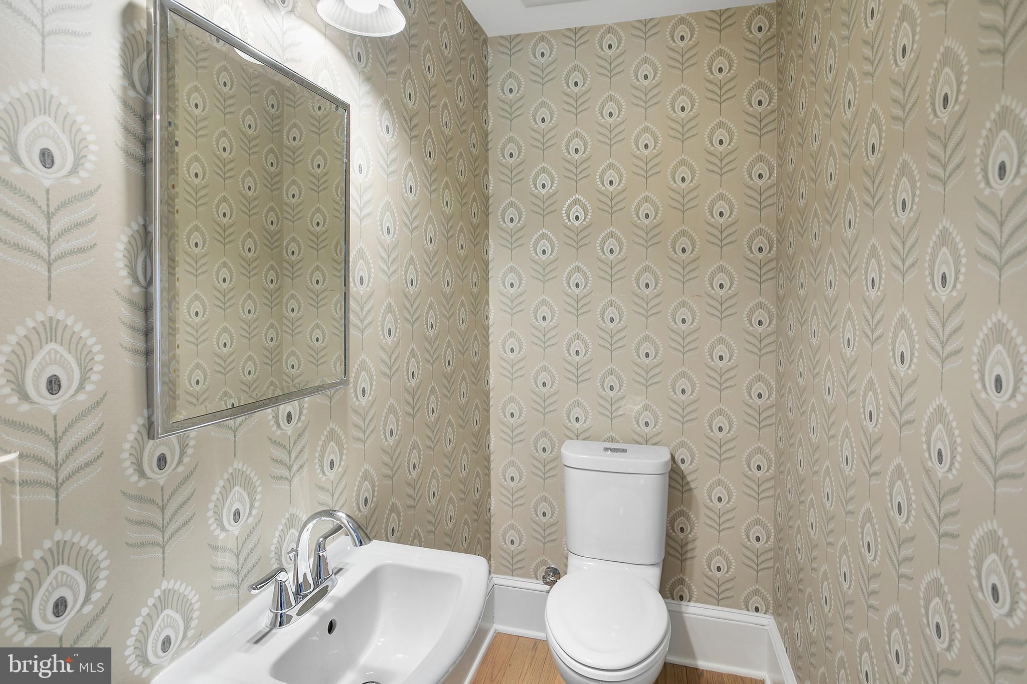 2807 Q Street Northwest Washington, DC 20007 - Photo 12 of 34 a white toilet sitting next to a bathroom sink