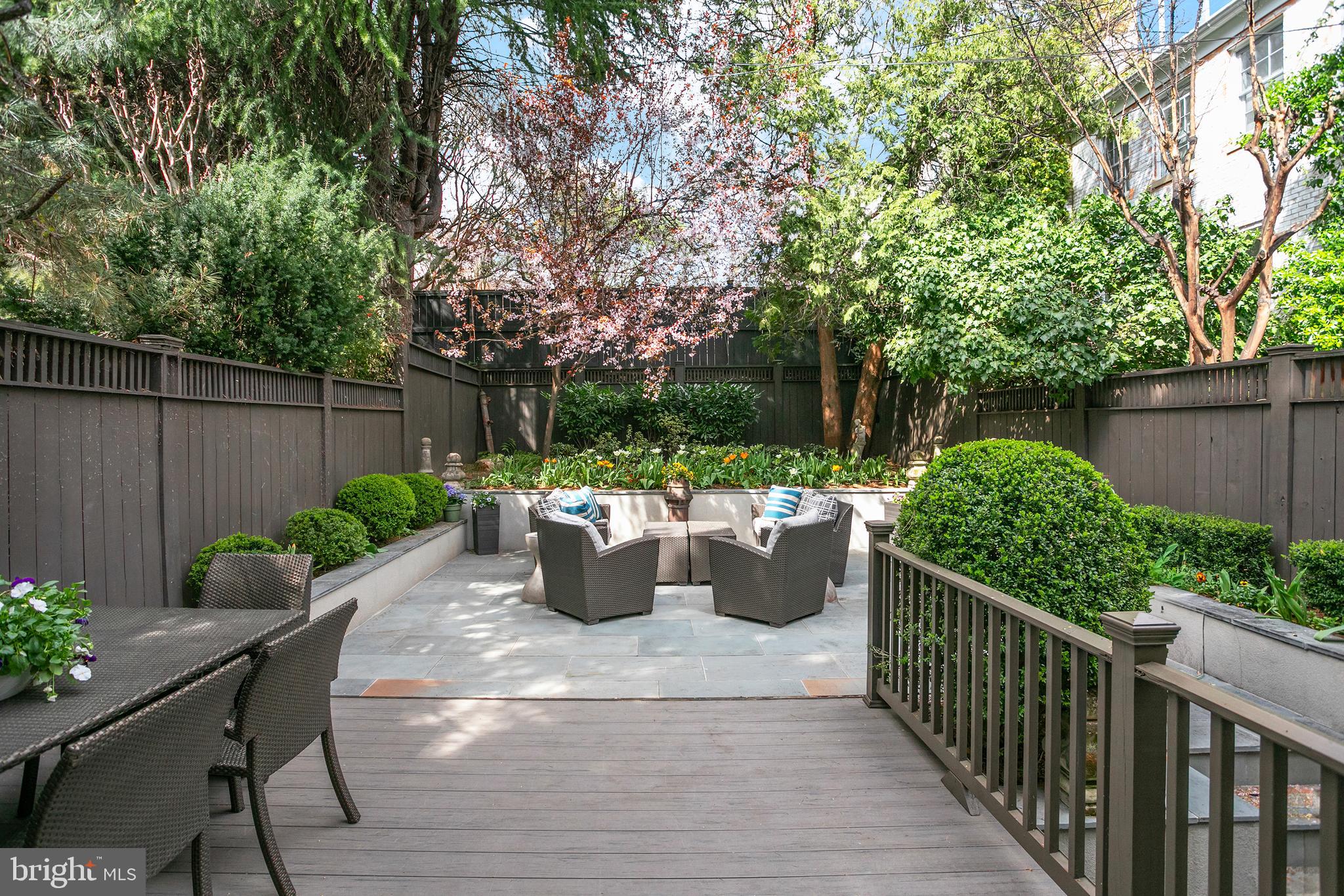2807 Q Street Northwest Washington, DC 20007 - Photo 13 of 34 a view of a backyard with sitting area and garden