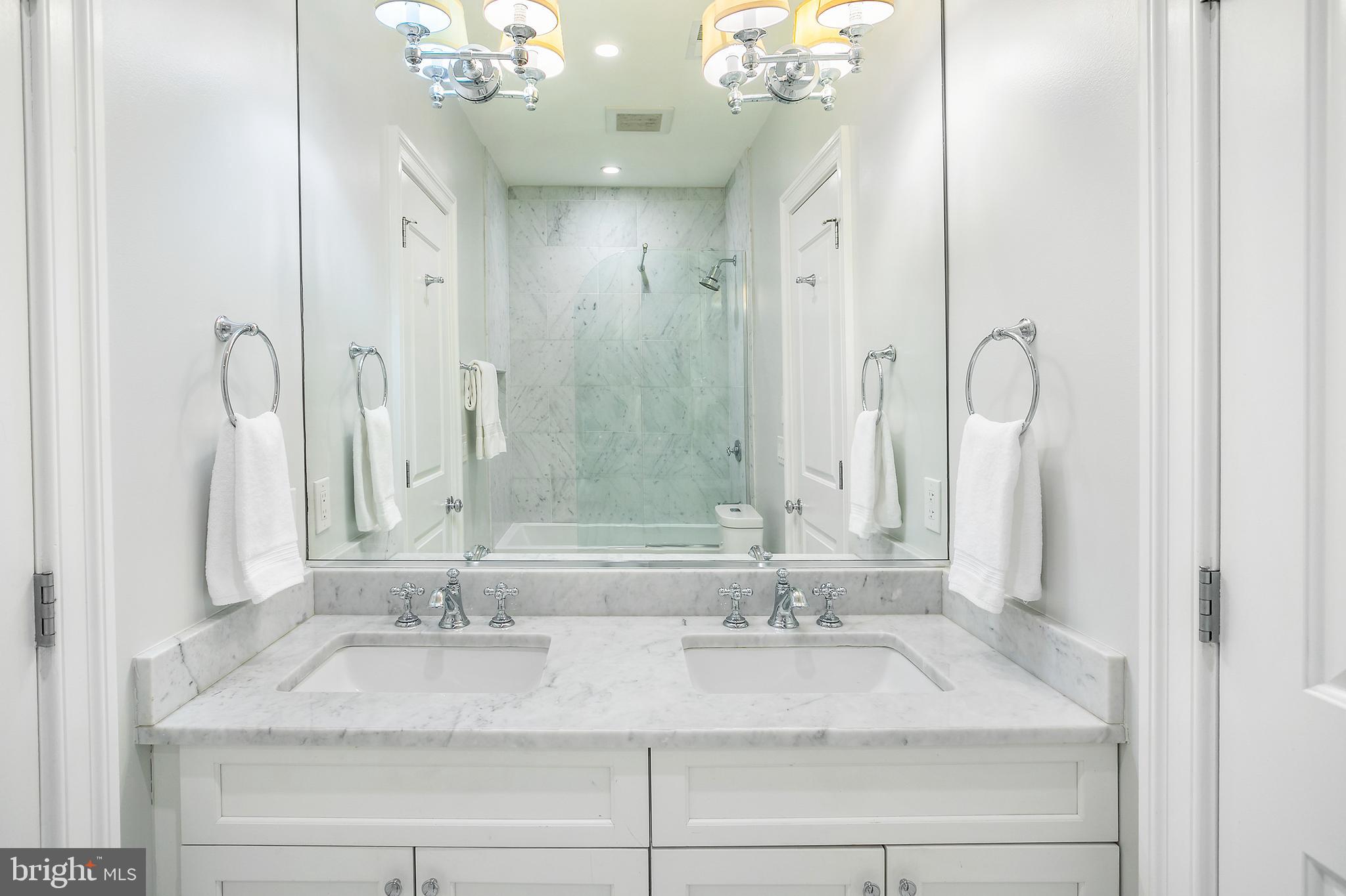 2807 Q Street Northwest Washington, DC 20007 - Photo 21 of 34 a bathroom with a sink double vanity granite and a mirror