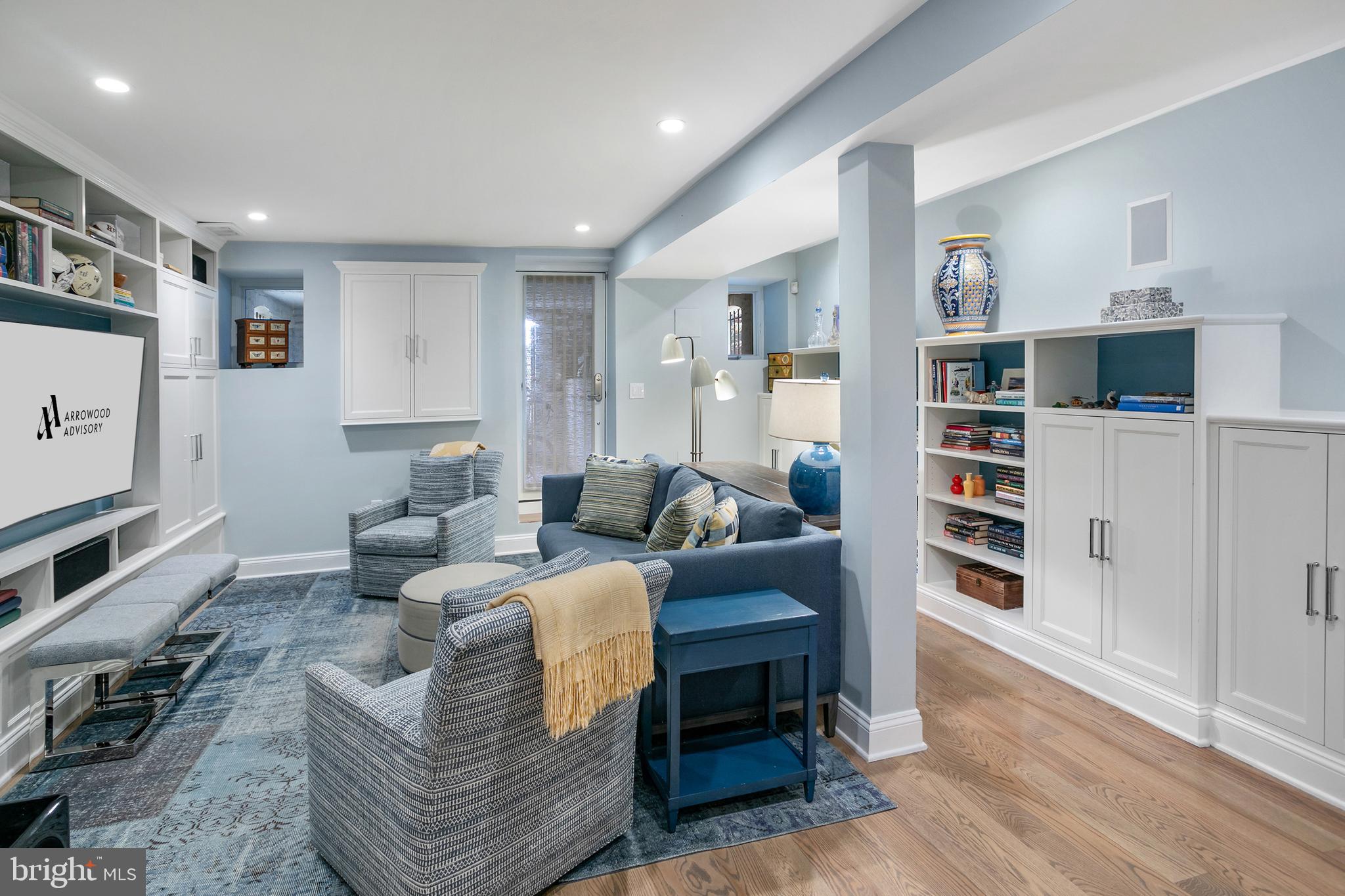 2807 Q Street Northwest Washington, DC 20007 - Photo 25 of 34 a living room with furniture wooden floor and a rug