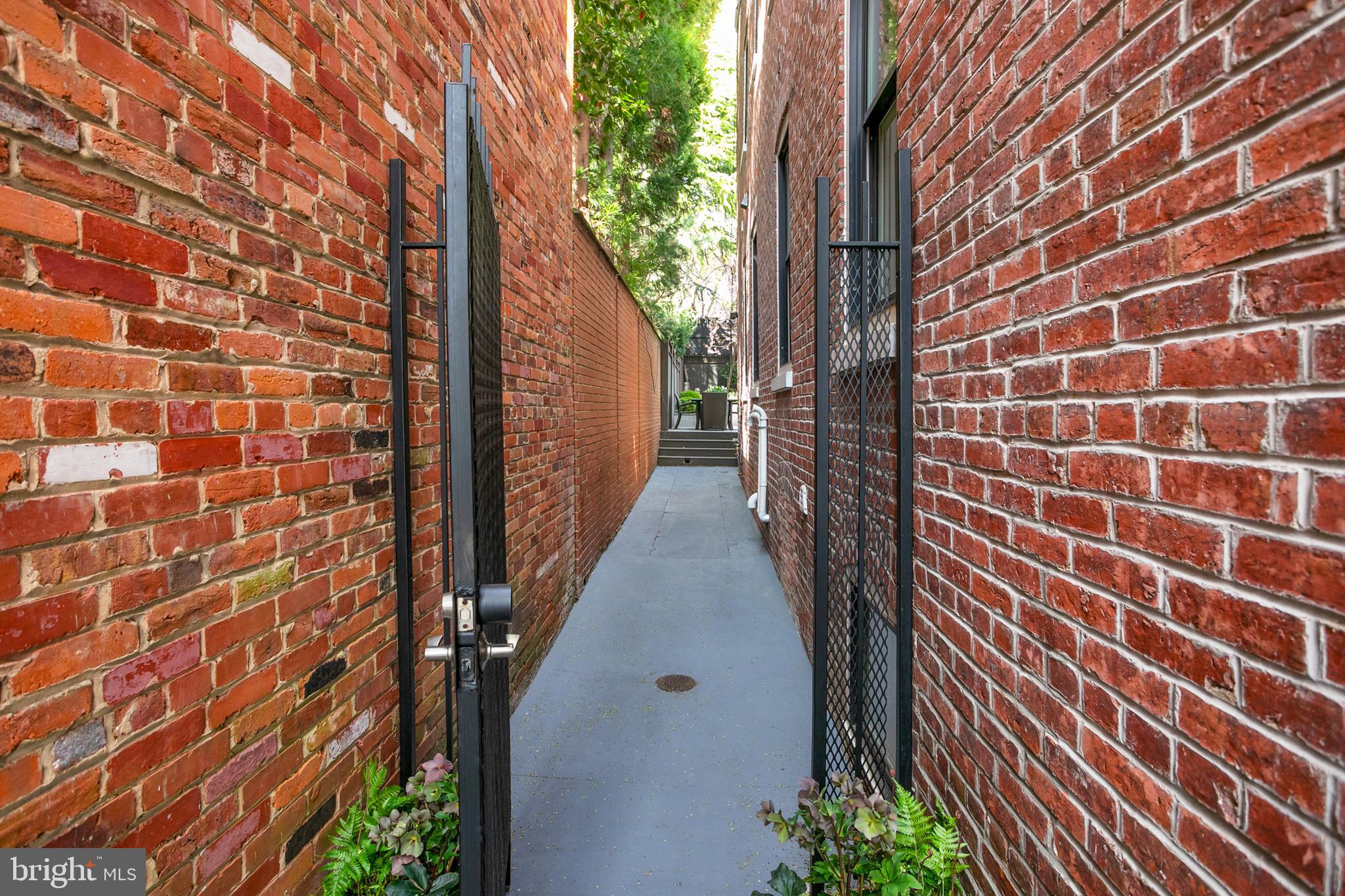 2807 Q Street Northwest Washington, DC 20007 - Photo 30 of 34 a view of a pathway with a wall