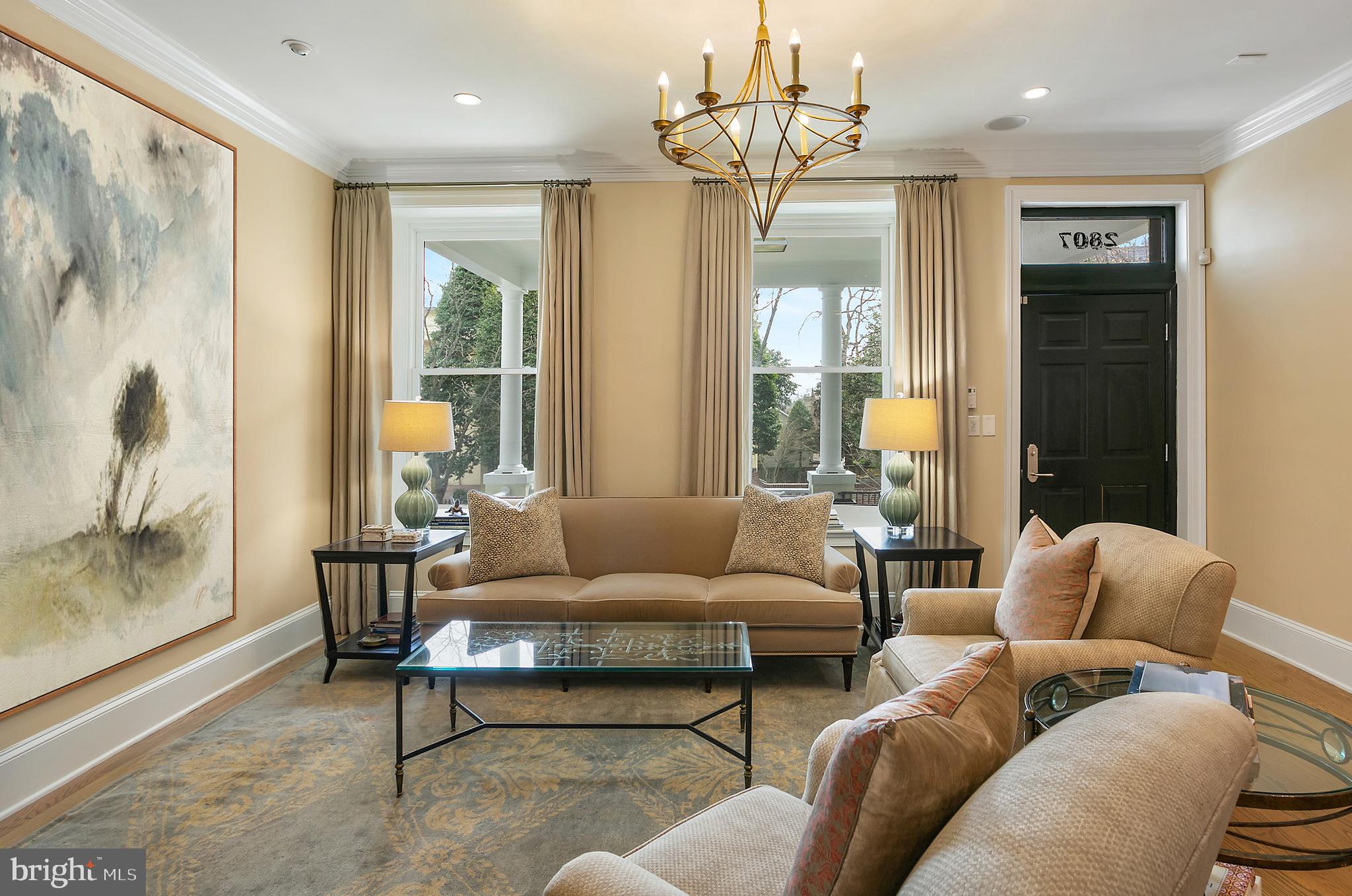 2807 Q Street Northwest Washington, DC 20007 - Photo 3 of 34 a living room with furniture and a chandelier