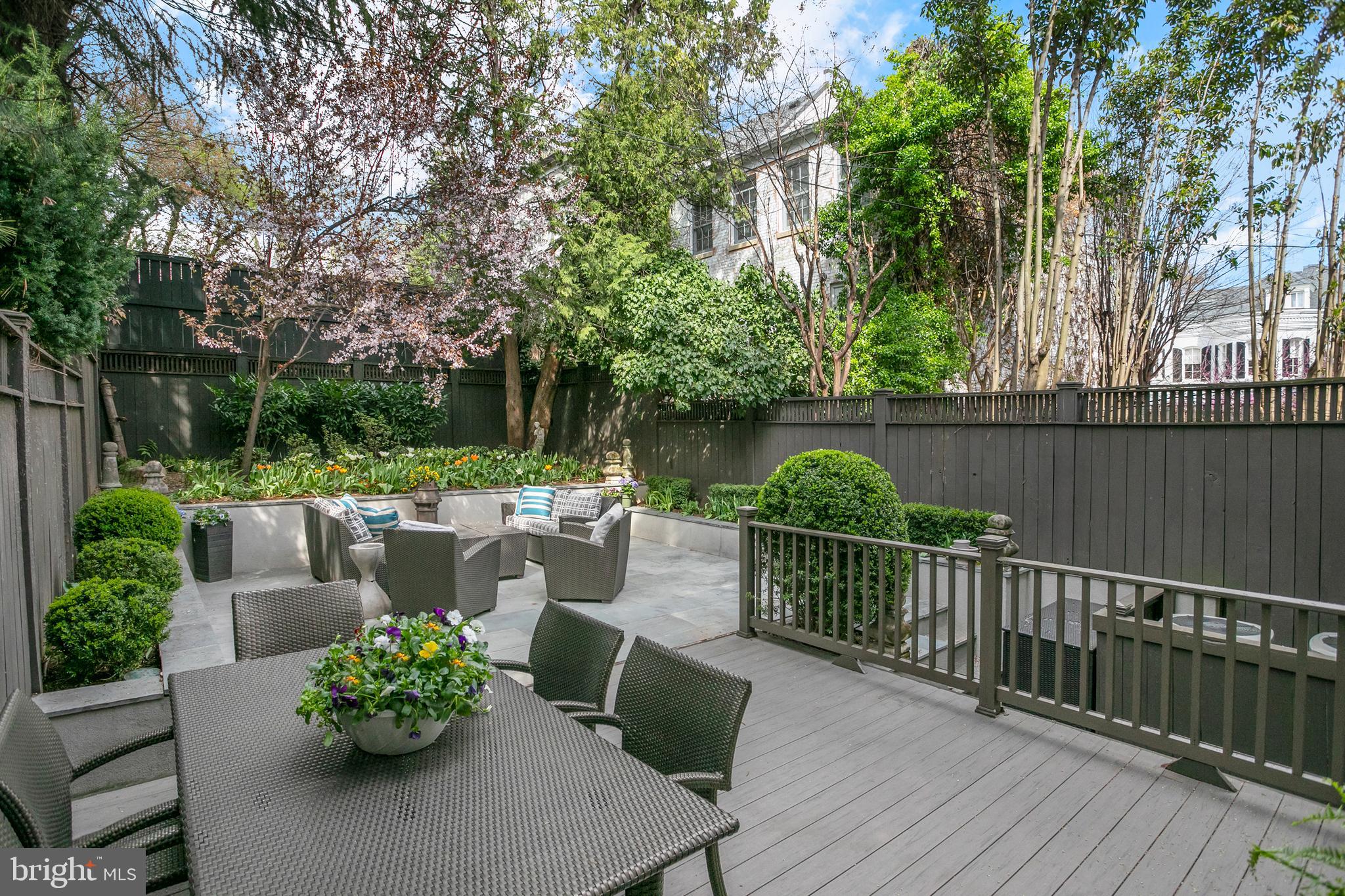 2807 Q Street Northwest Washington, DC 20007 - Photo 31 of 34 a view of a table and chairs on the roof deck