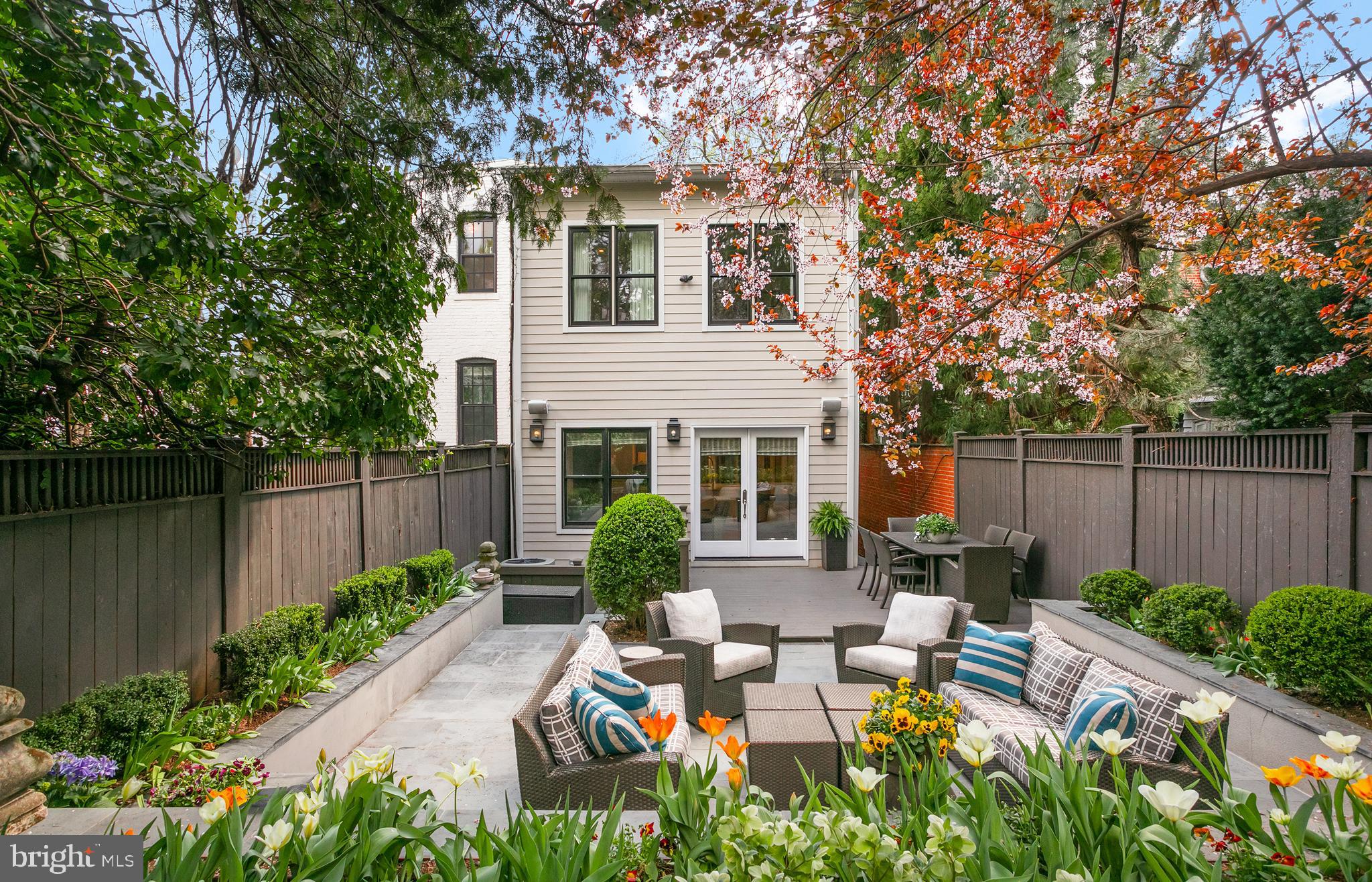 2807 Q Street Northwest Washington, DC 20007 - Photo 33 of 34 a view of a house with backyard sitting area and garden