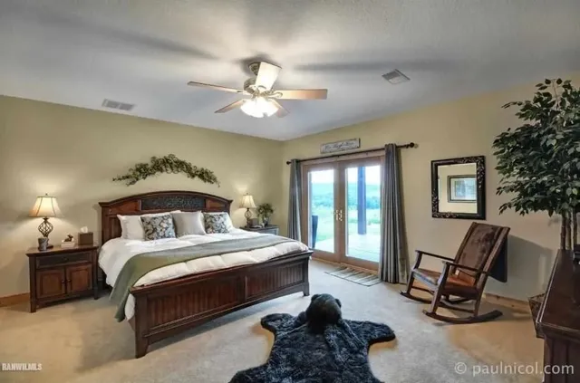 a bedroom with a bed a desk and chair