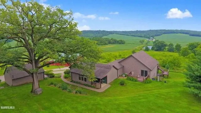 a aerial view of a house with pool
