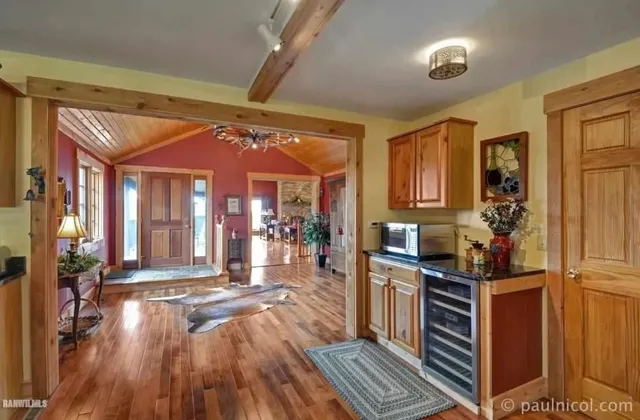 a open kitchen with stainless steel appliances granite countertop a stove and refrigerator
