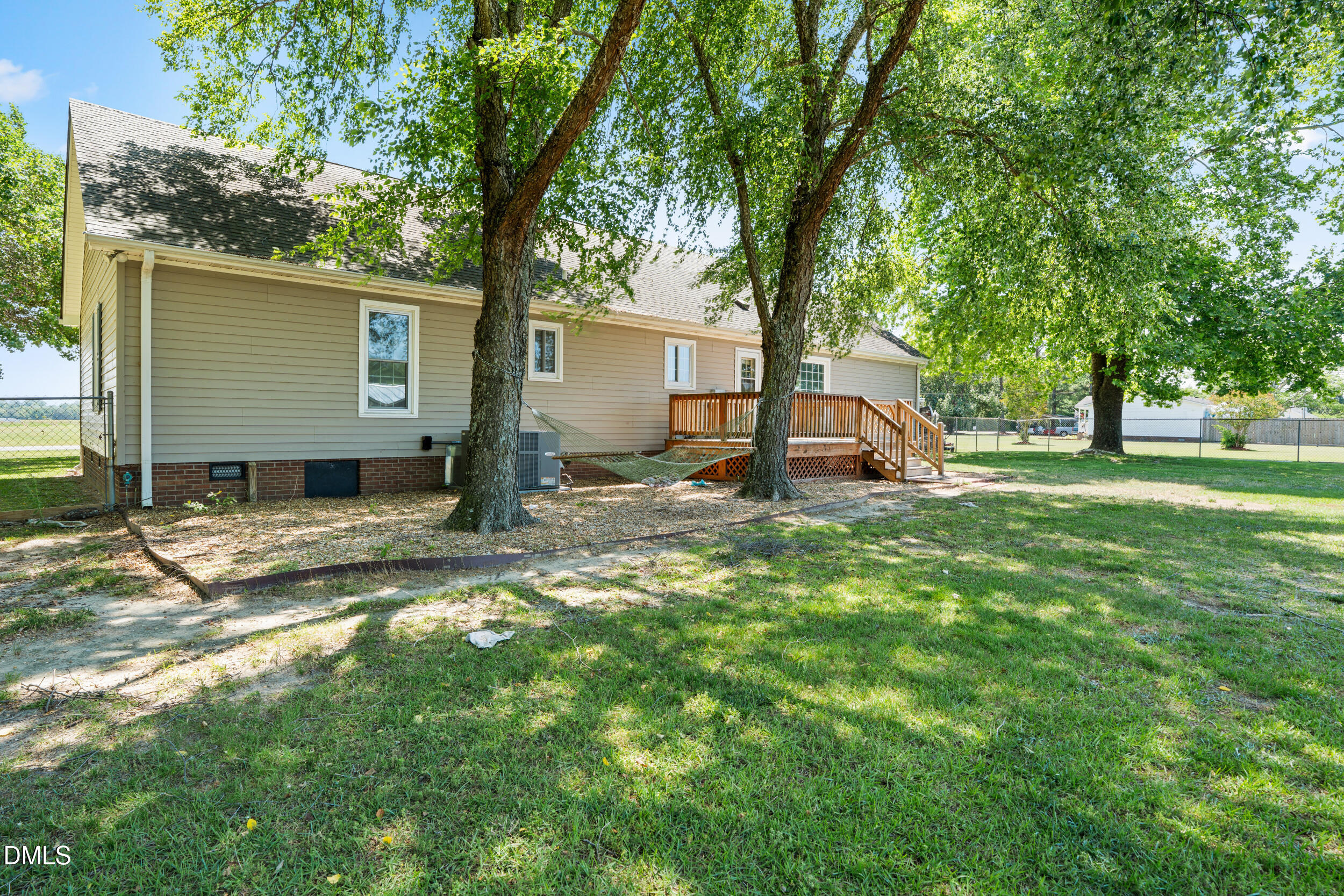 311 Bridgers Road Kenly, NC 27542 - Photo 34 of 46 a view of a house with a yard and tree
