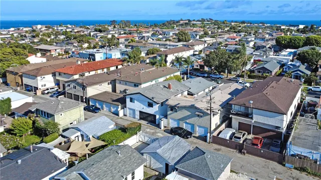 an aerial view of a residential apartment building with a city view