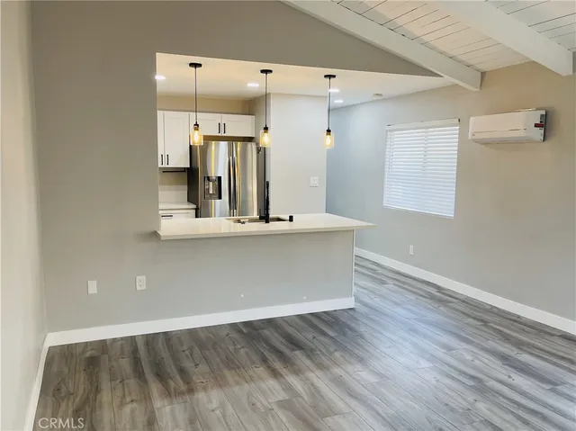 a view of cabinets and wooden floor