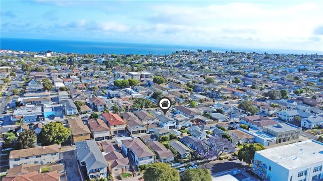 an aerial view of a city with lots of residential buildings