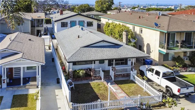 an aerial view of a house with swimming pool and furniture