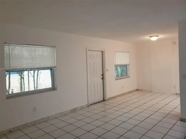 a view of an empty room and window