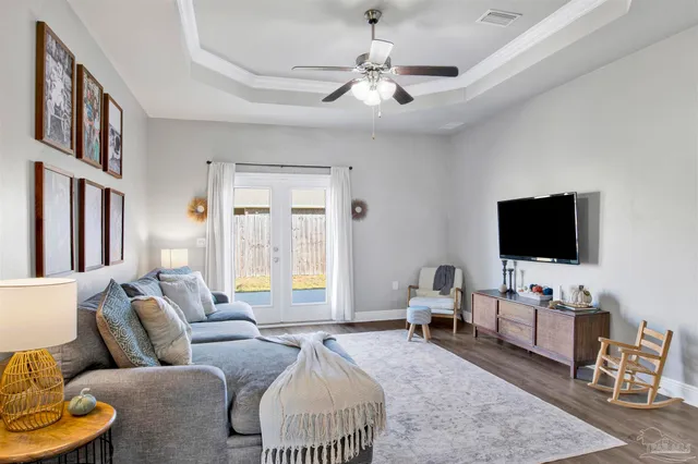 a living room with furniture and a flat screen tv