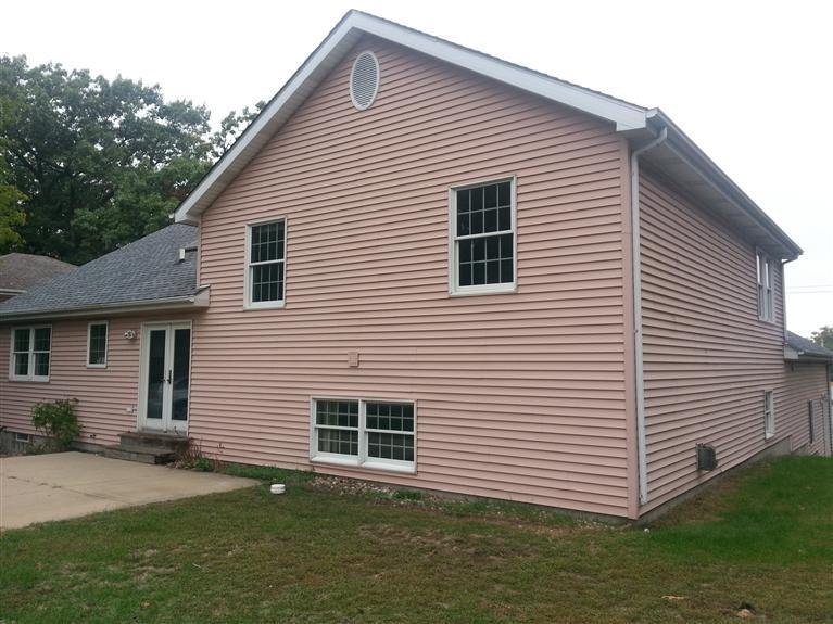 3528 Ridge Road Highland, IN 46322 - Photo 2 of 10 a view of a white house next to a yard