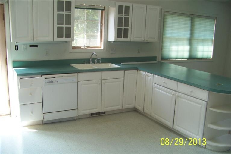 3528 Ridge Road Highland, IN 46322 - Photo 5 of 10 a kitchen with granite countertop white cabinets and sink
