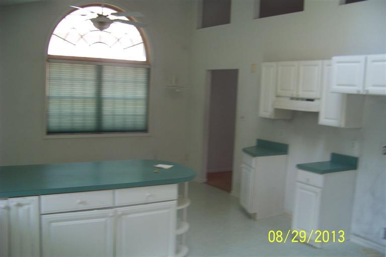 3528 Ridge Road Highland, IN 46322 - Photo 6 of 10 a view of kitchen with granite countertop white cabinets and a sink