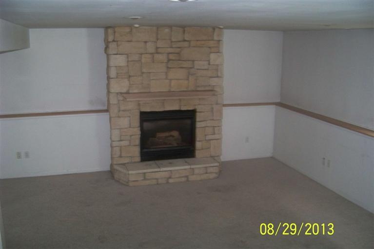 3528 Ridge Road Highland, IN 46322 - Photo 7 of 10 a view of an empty room with a fireplace