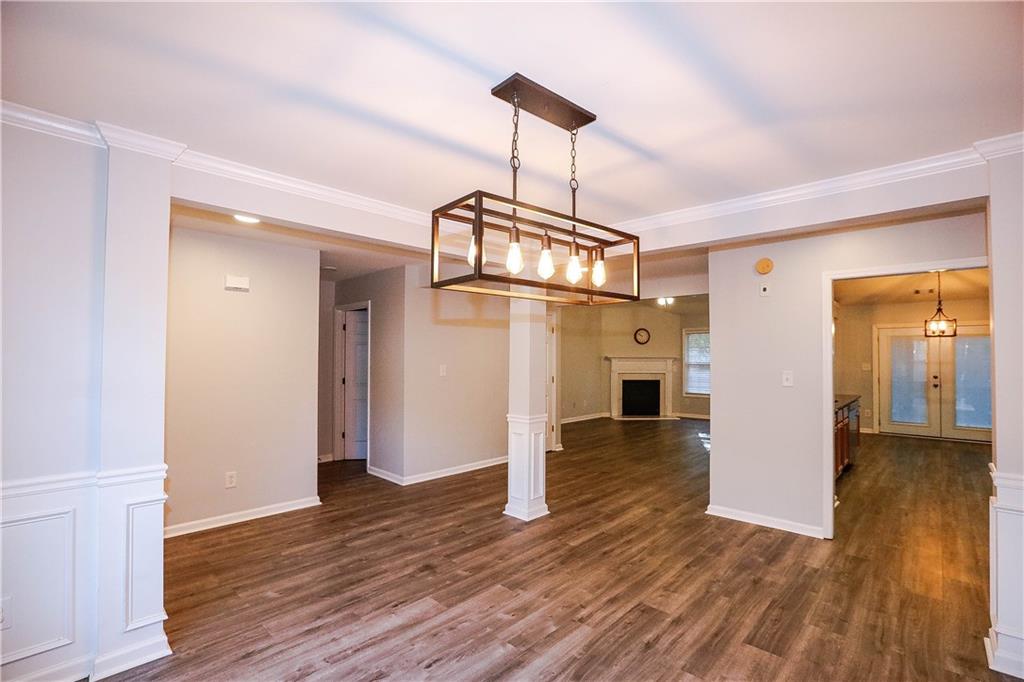 3264 Star Pine Court Duluth, GA 30096 - Photo 20 of 43 a view of a livingroom with wooden floor a ceiling fan and window