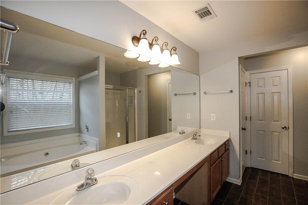 3264 Star Pine Court Duluth, GA 30096 - Photo 28 of 43 a bathroom with a double vanity sink mirror and double