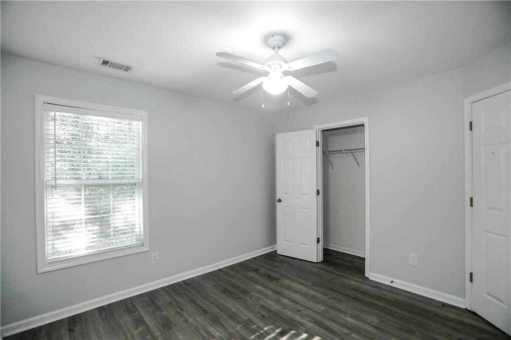 3264 Star Pine Court Duluth, GA 30096 - Photo 35 of 43 a view of an empty room with wooden floor and a window