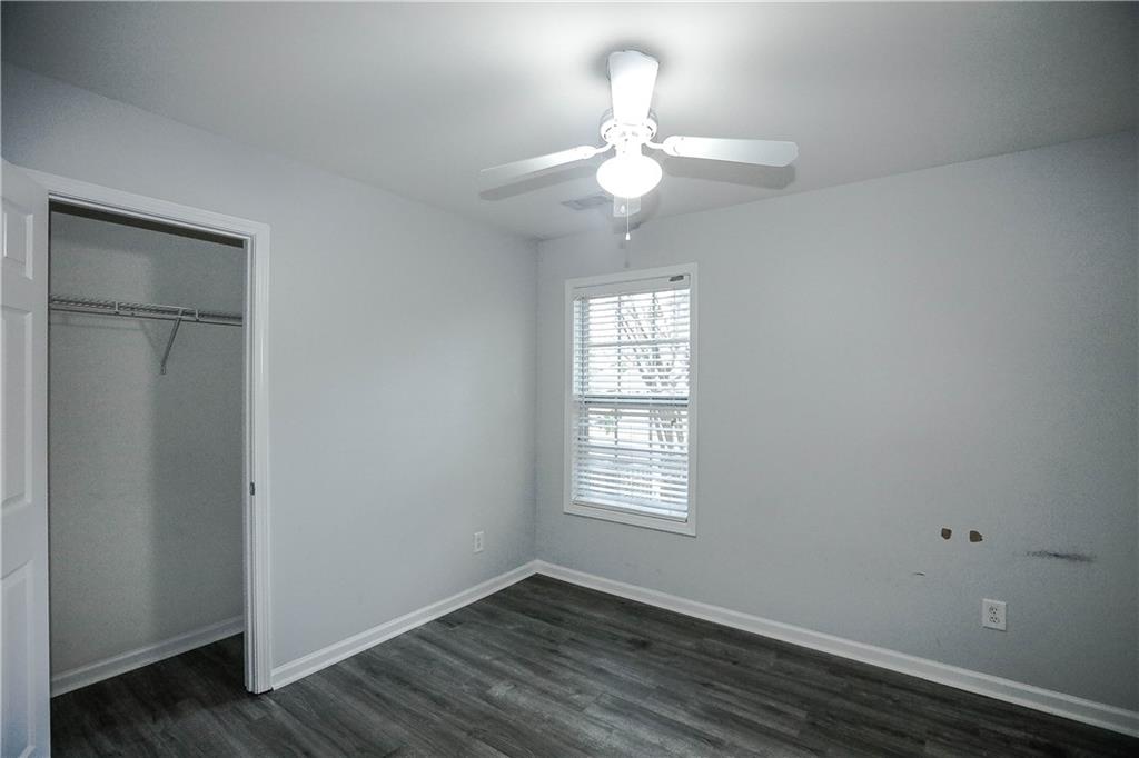 3264 Star Pine Court Duluth, GA 30096 - Photo 37 of 43 a view of an empty room with wooden floor and a window
