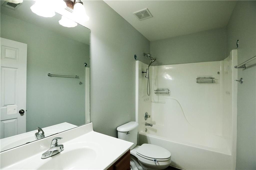 3264 Star Pine Court Duluth, GA 30096 - Photo 39 of 43 a bathroom with a sink a toilet and shower