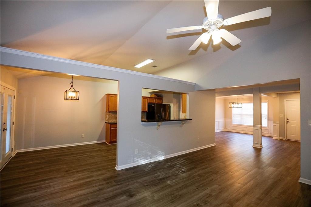 3264 Star Pine Court Duluth, GA 30096 - Photo 7 of 43 a view of an empty room with wooden floor and a window