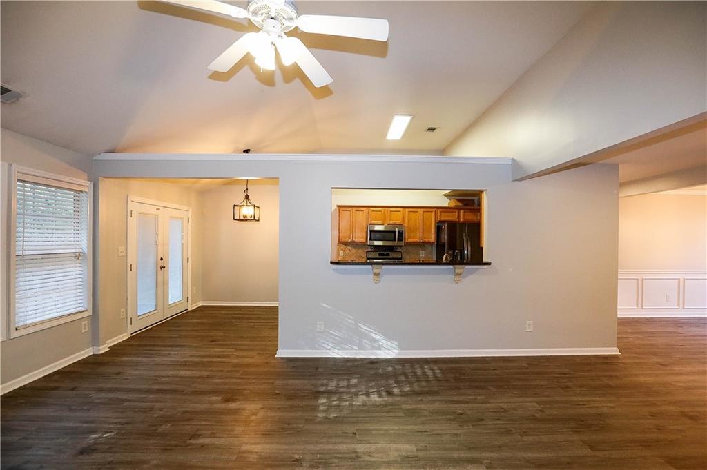 3264 Star Pine Court Duluth, GA 30096 - Photo 8 of 43 a view of empty room with window and wooden floor