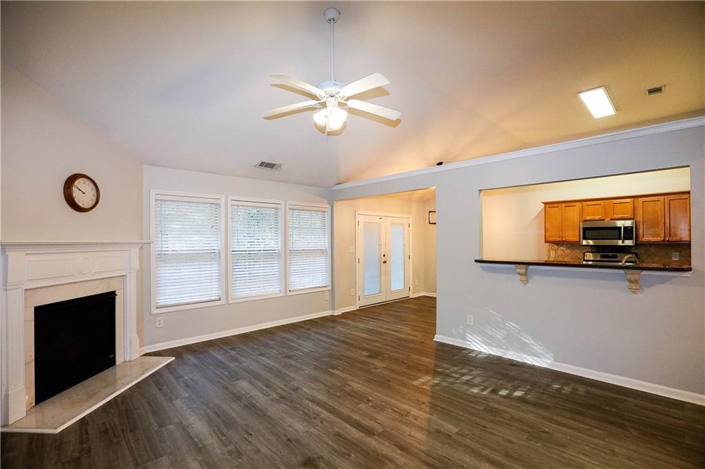 3264 Star Pine Court Duluth, GA 30096 - Photo 9 of 43 a view of empty room with wooden floor and fan