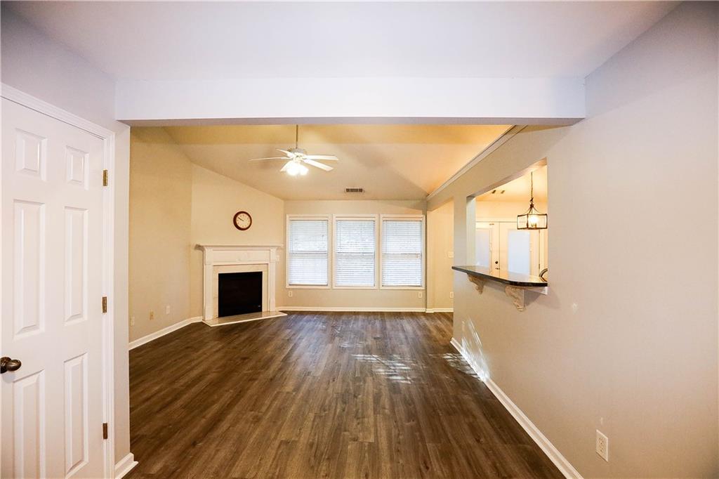 3264 Star Pine Court Duluth, GA 30096 - Photo 10 of 43 a view of empty room with wooden floor and fan