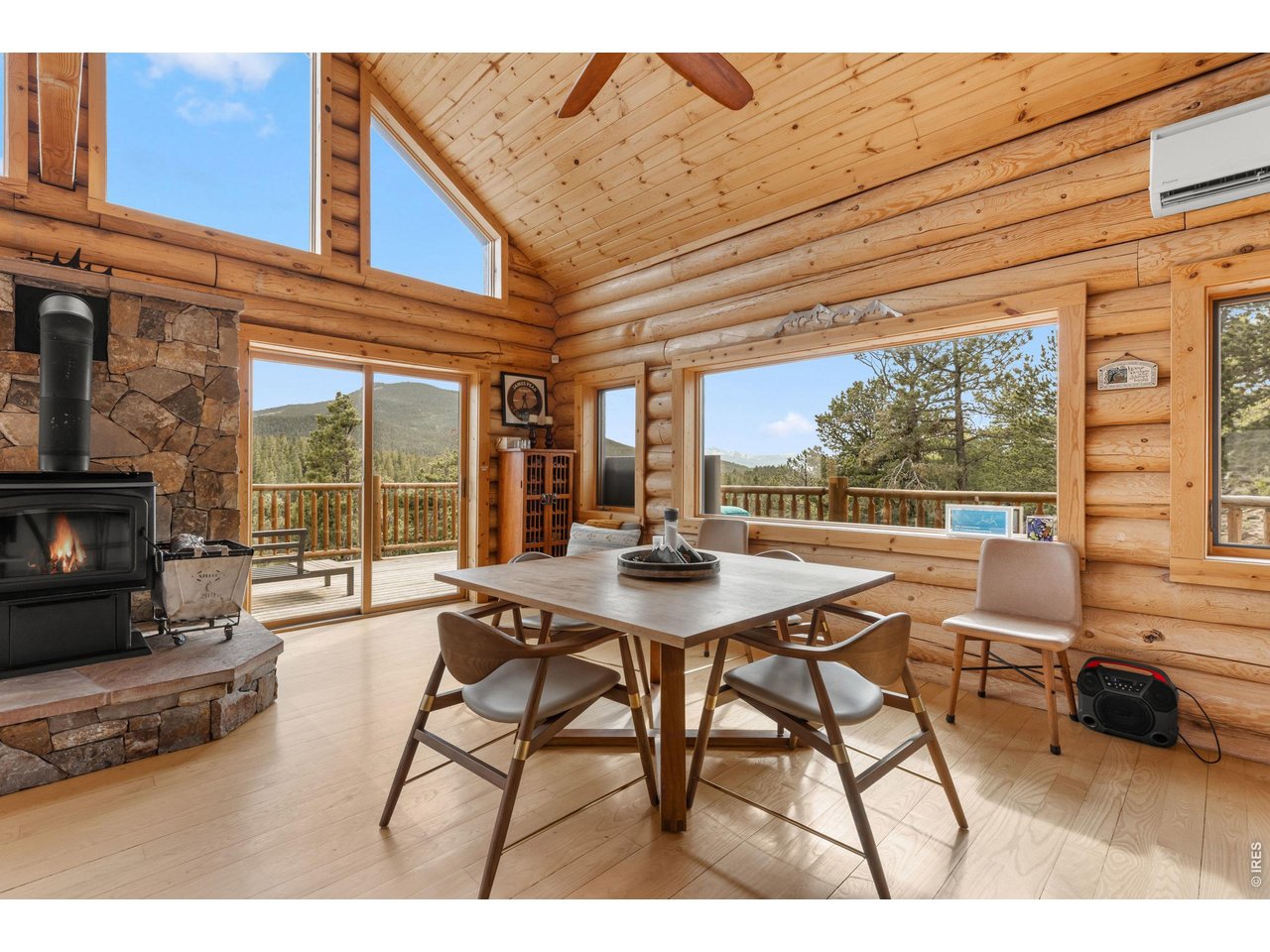 1028 Rudi Lane Golden, CO 80403 - Photo 15 of 46 a view of a patio with table and chairs with wooden floor and fence